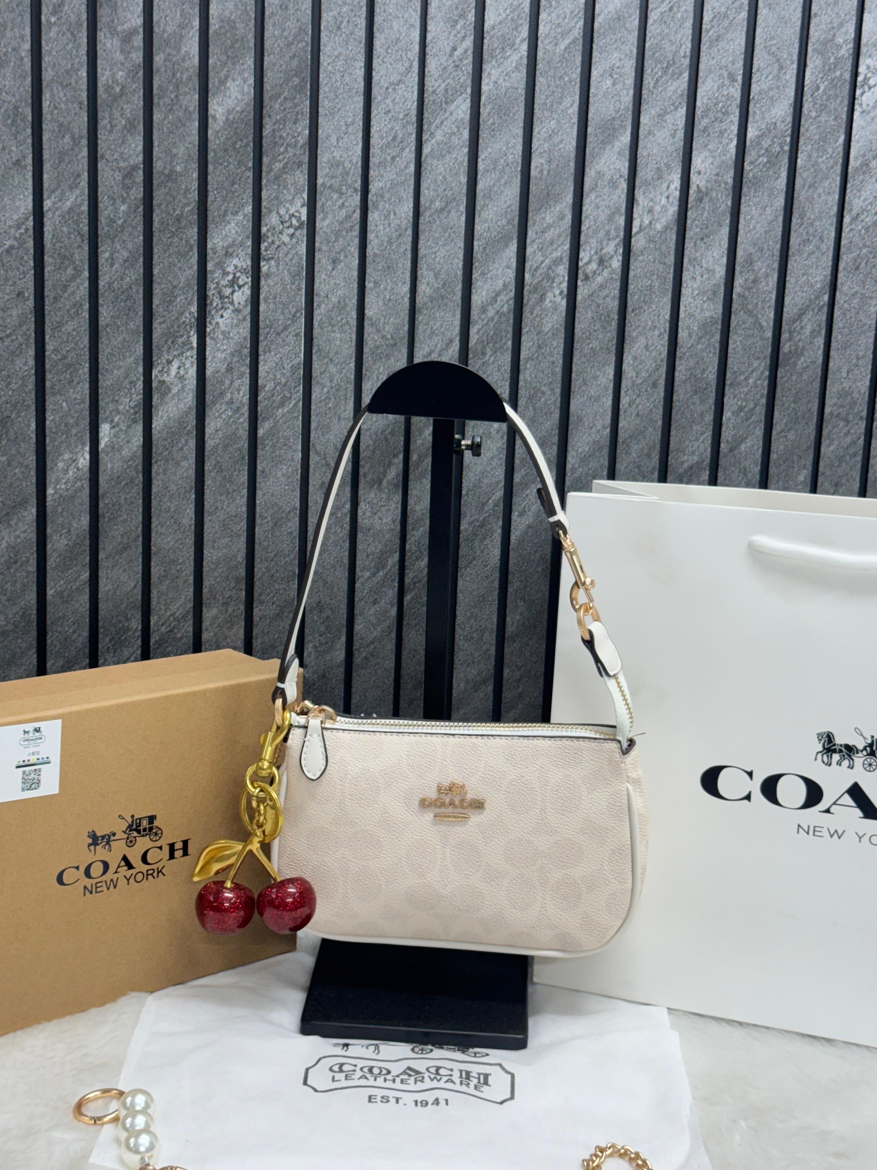 Coac_h Nolita 19 with Cherry Charm