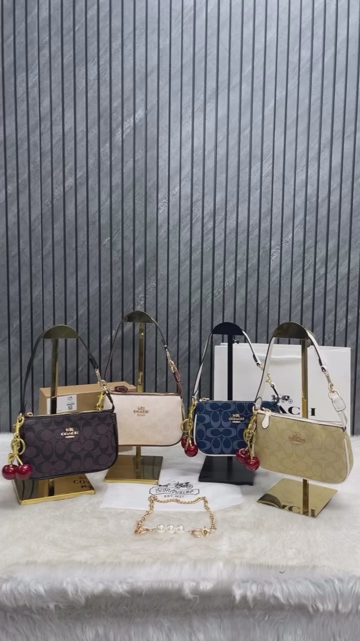 Coac_h Nolita 19 with Cherry Charm